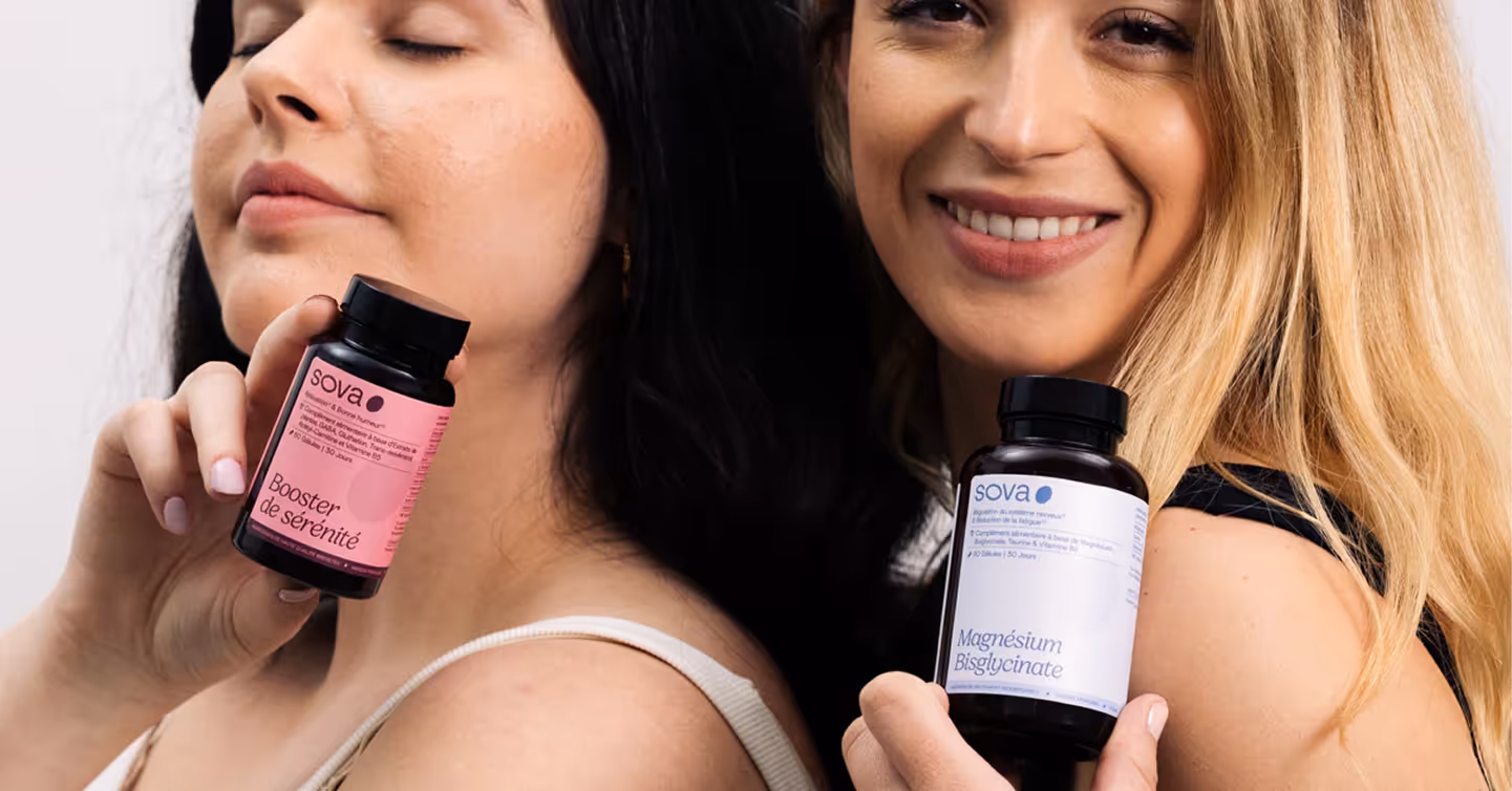 two smiling women presenting a Sova product