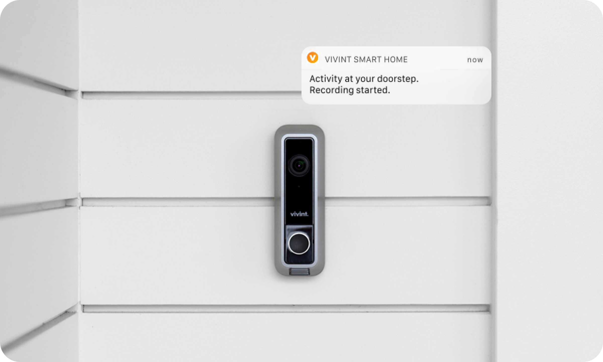 A smart phone is attached to a wall.