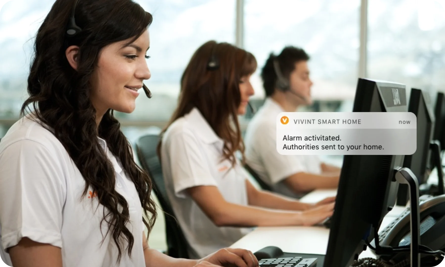 A woman sitting in front of a laptop computer.
