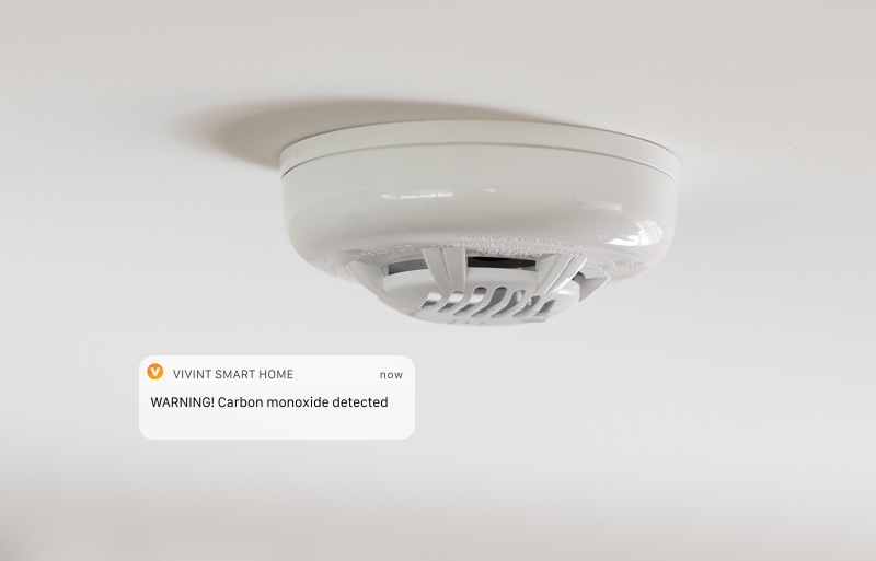 A close up of a camera on a ceiling.