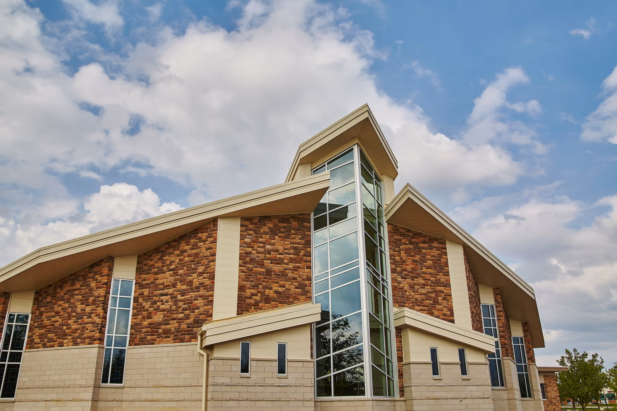 A modern brick and glass church building.