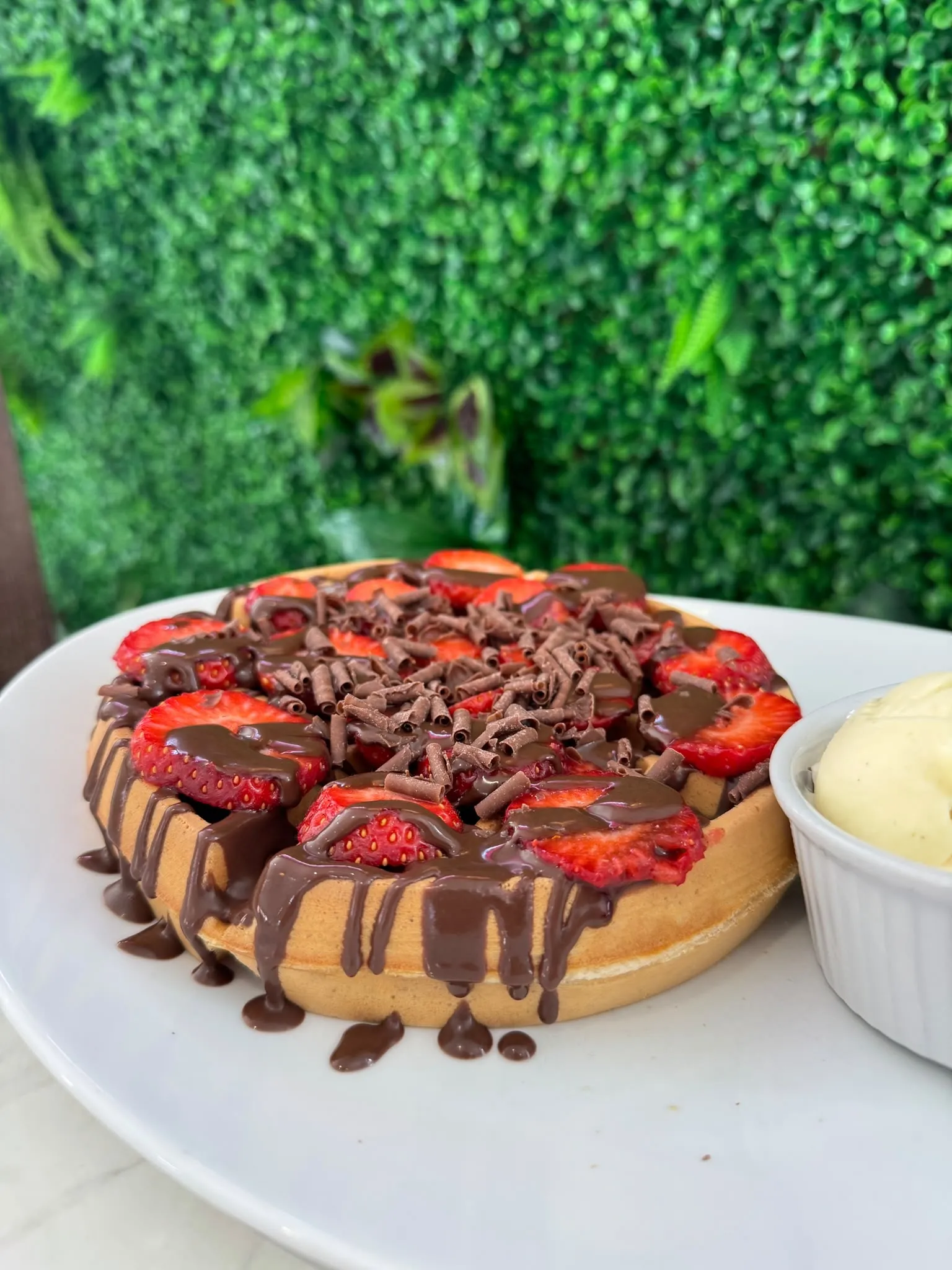 Waffle with strawberries and chocolate