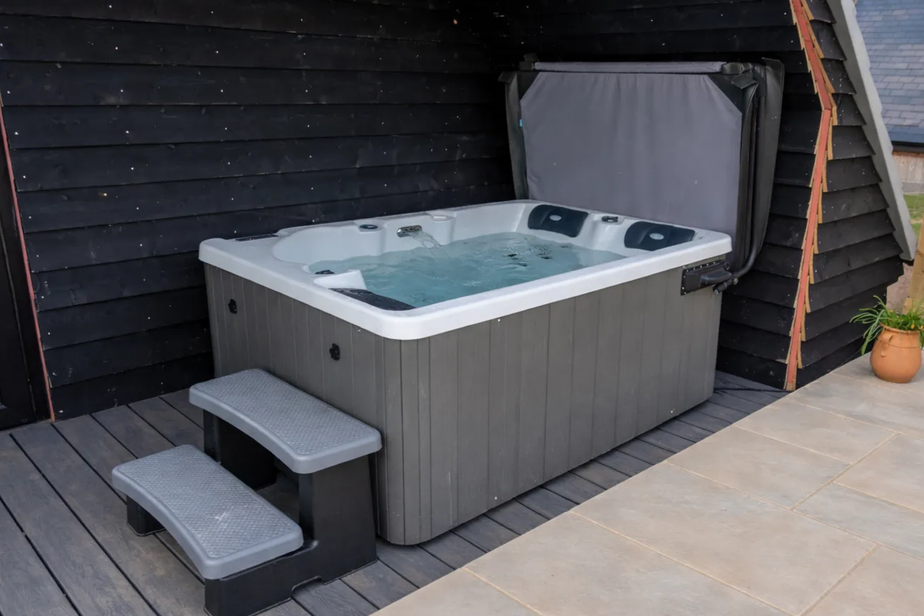 Close-up of vibrant green fern leaves with delicate droplets of water, surrounded by a soft, blurred natural background.