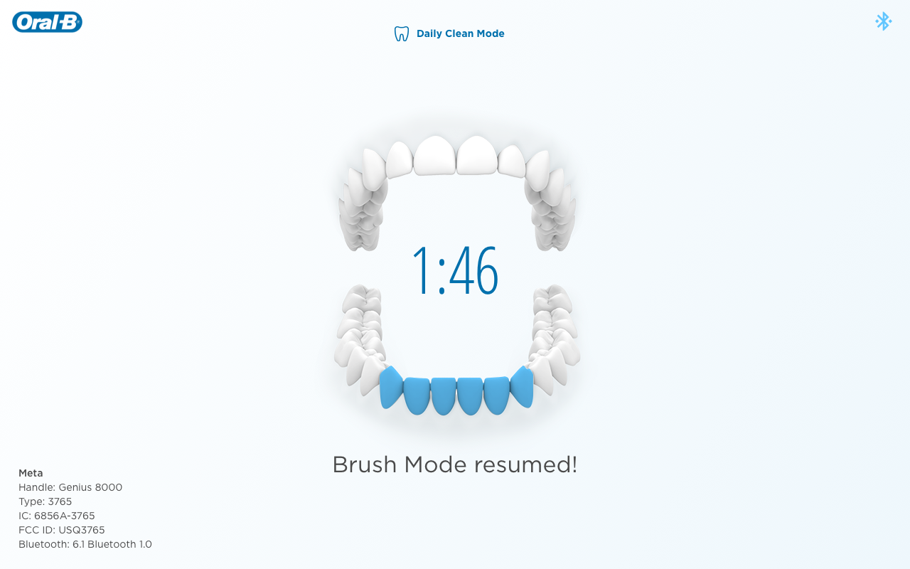 A snapshot of a brushing session with a model of 3D teeth and a countdown in the center saying "Brushing mode resumed!"