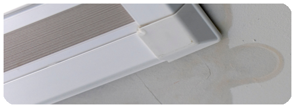 leaking around a bad skylight installation showing water damage on the ceiling drywall
