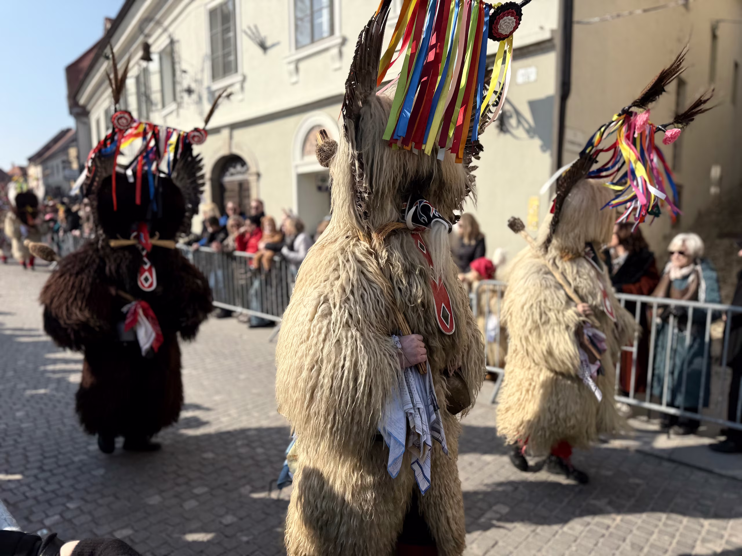 Traditional kurent in Ptuj walking down the street during a parade