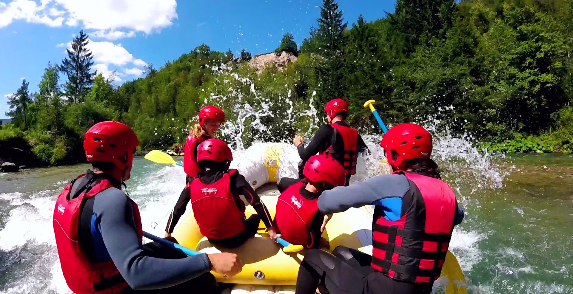 family rafting on Soča river in Slovenia