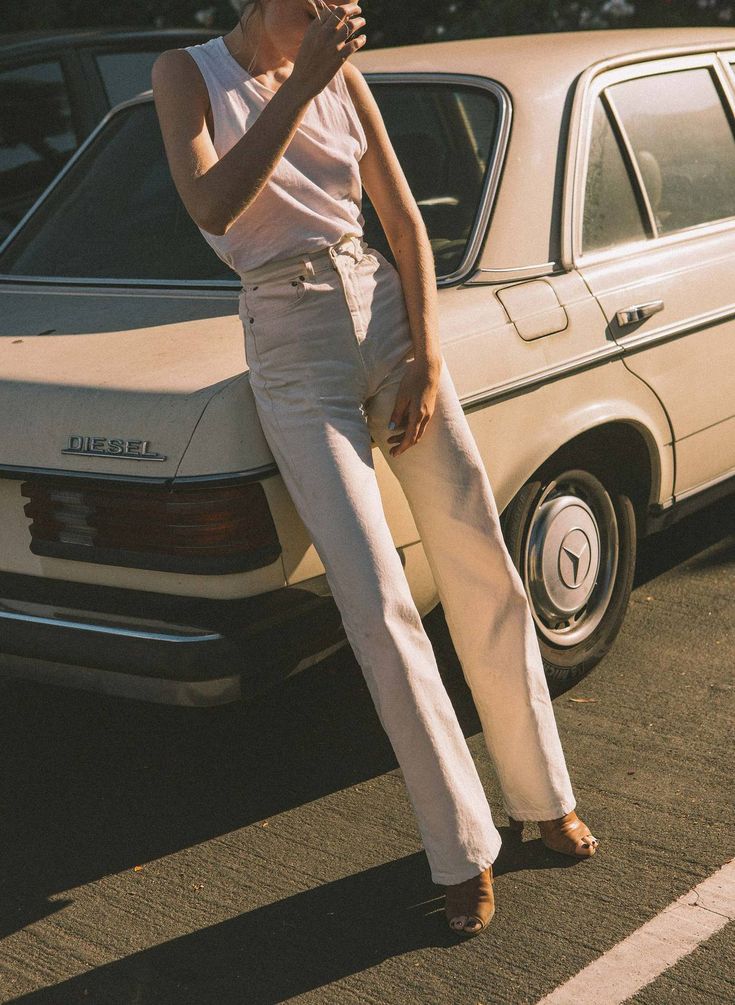 Person Leaning on vintage car
