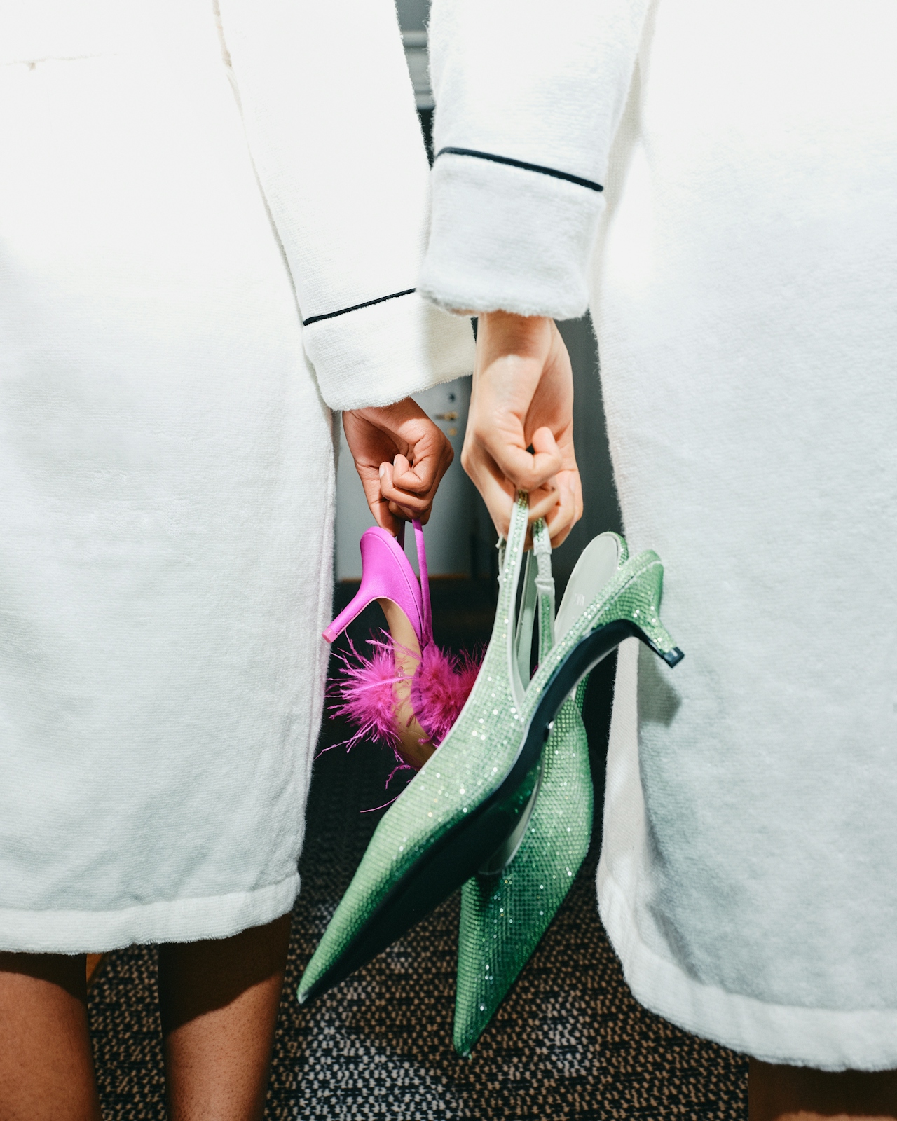 People in robes holding heels