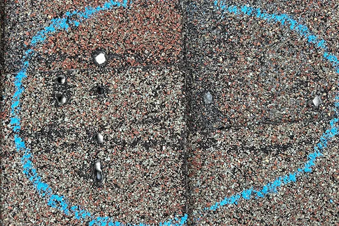 Aging asphalt shingle roof showing wear and nail pops in Oviedo Florida