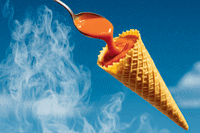 A spoon pours hot soup into a cone
