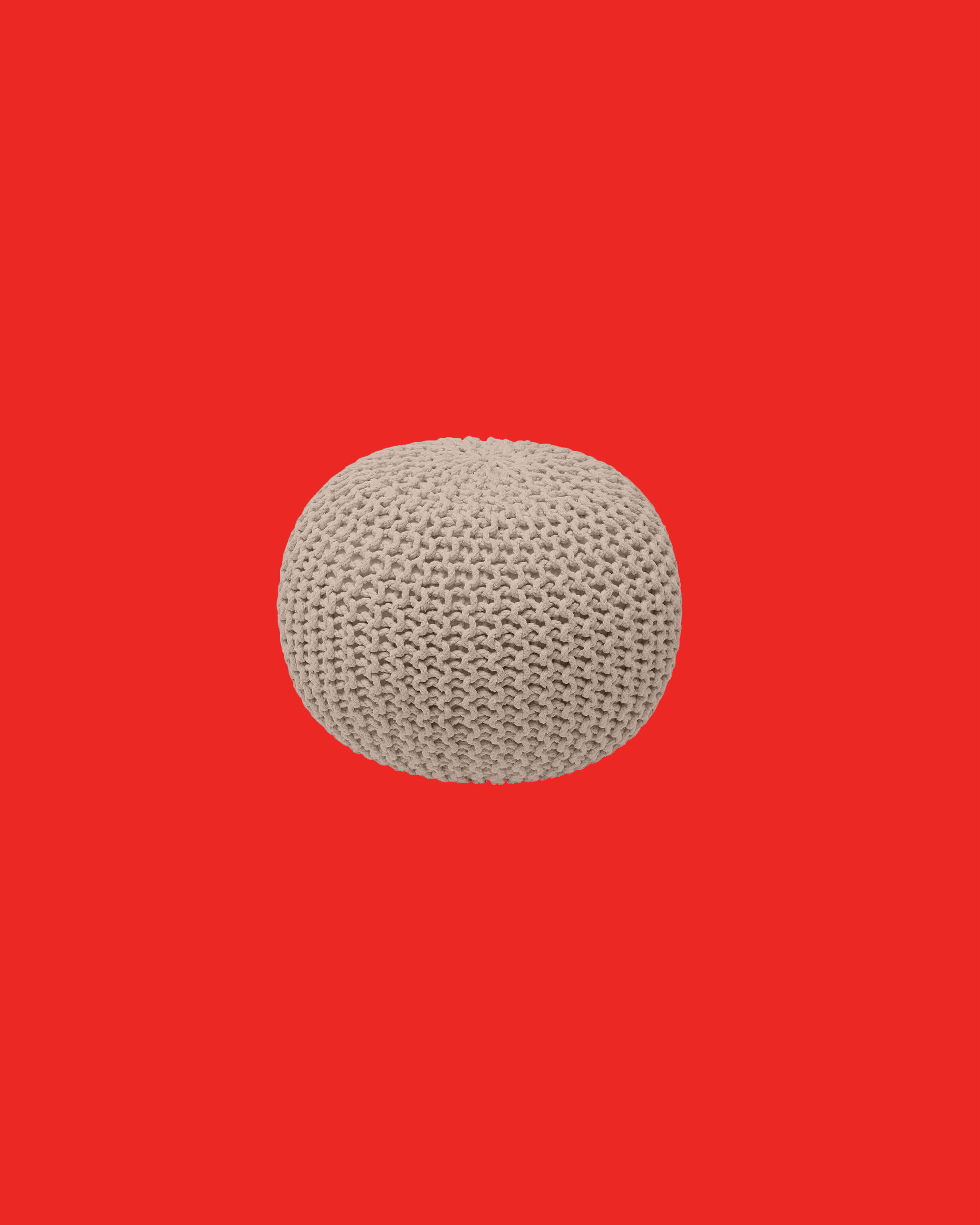 Beige knitted round pouf against a solid red background.