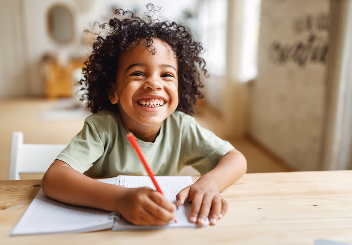 Child happily engaged in a time management assessment 