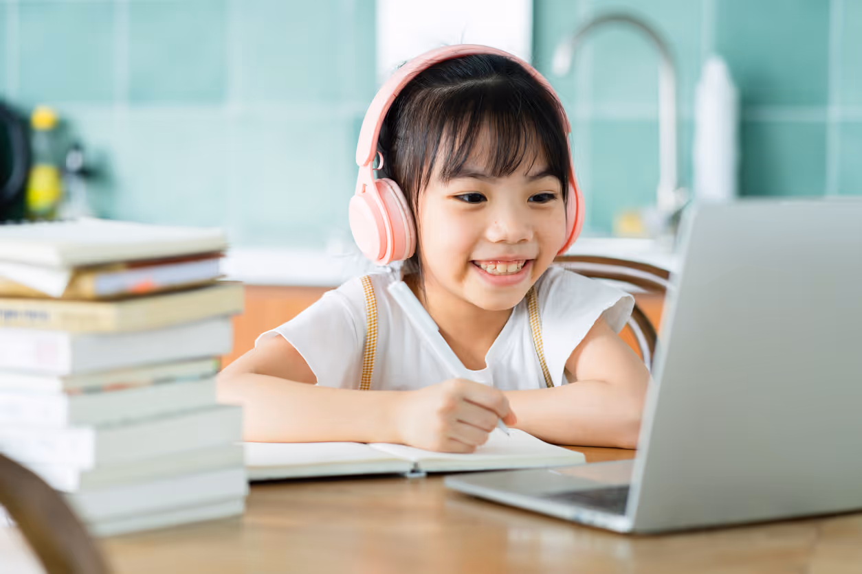 Student engaged with digital tools to improve time management skills in executive function coaching session