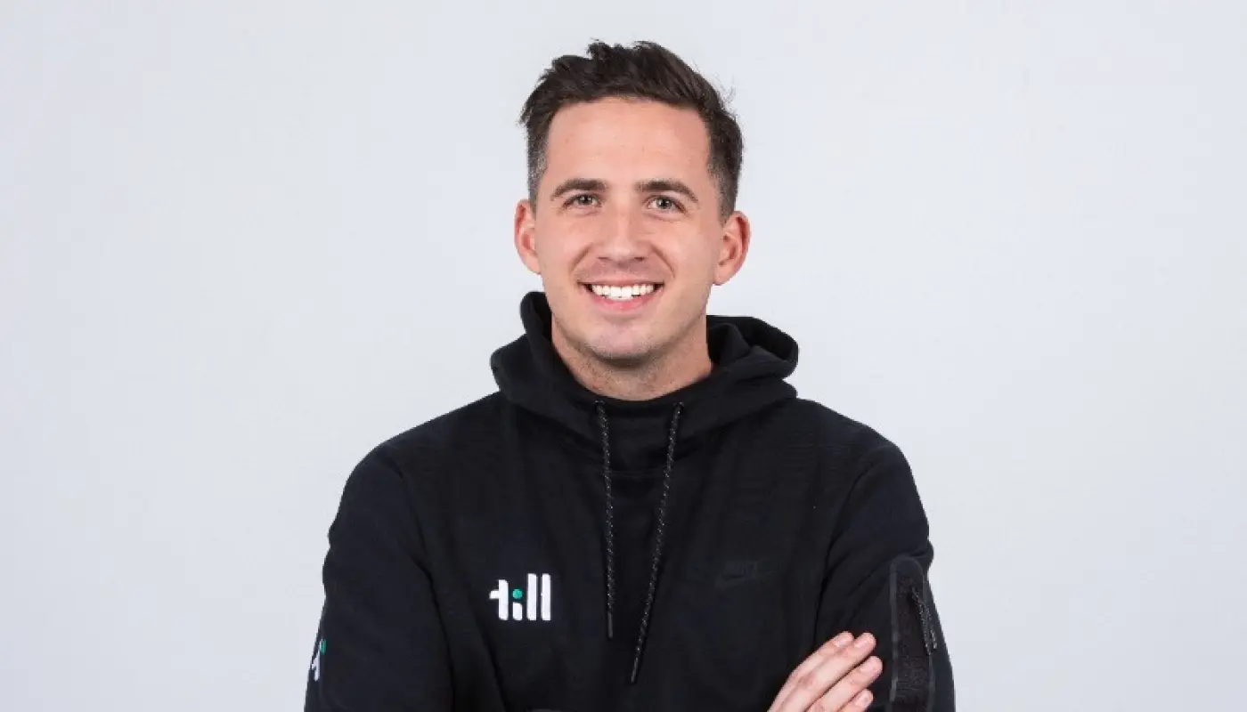 A headshot of Taylor Burton, CEO of Till Financial