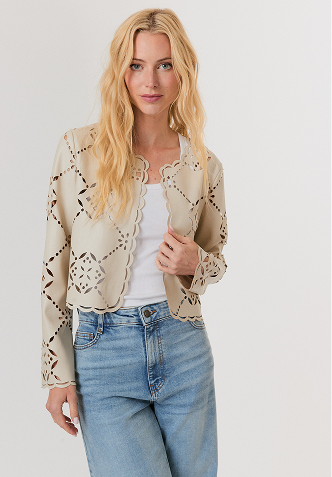 Woman wearing a black mesh sweater and a black leather midi skirt with studded high heel sandals.