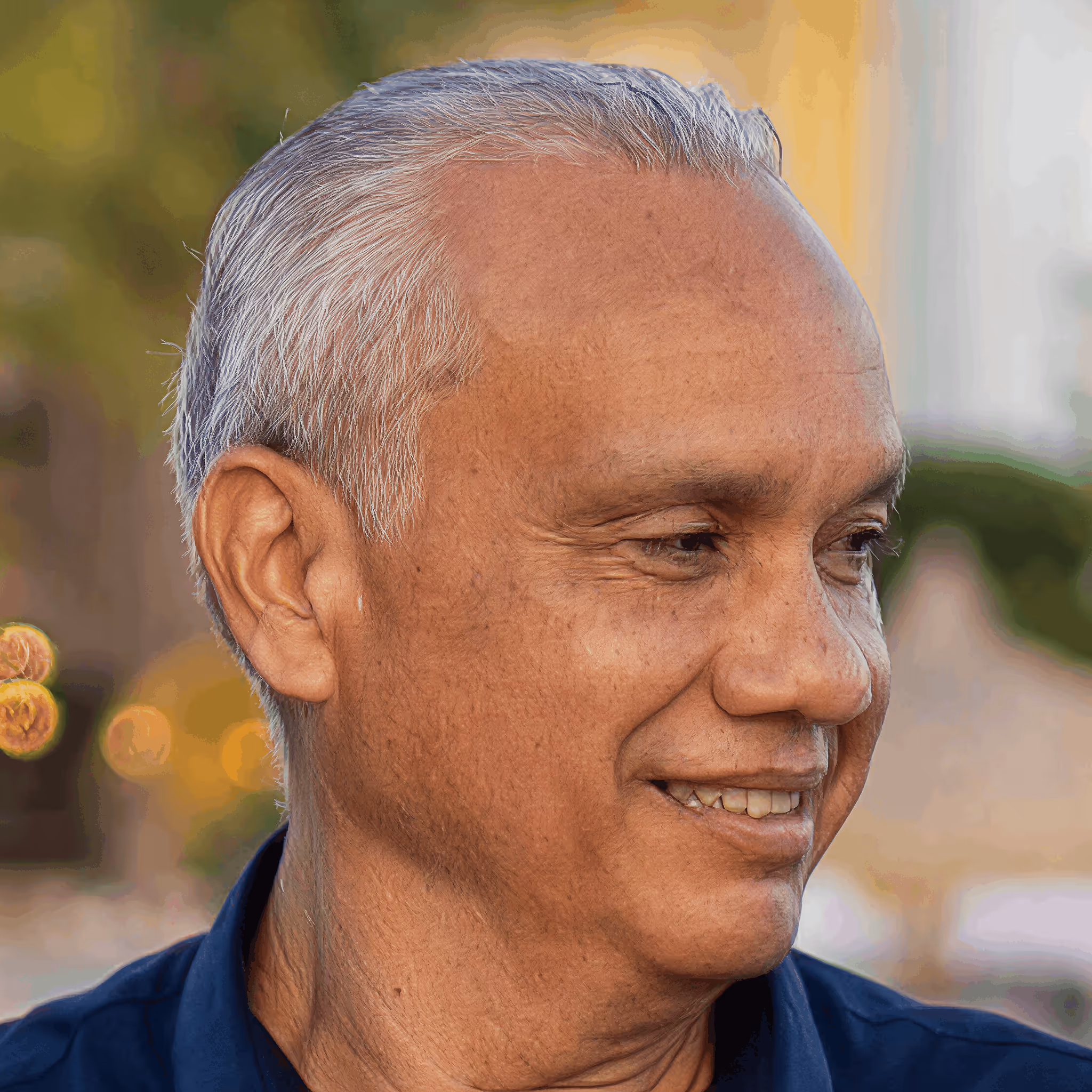 Professional headshot of the CEO of Unified Technology Group smiling.