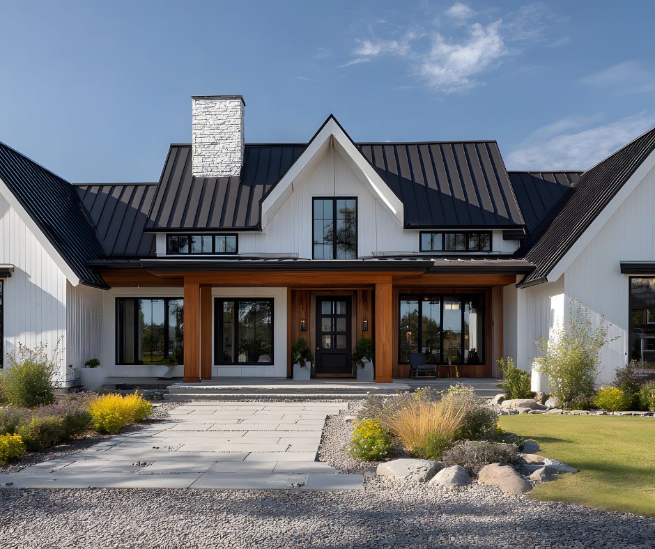 Modern farmhouse exterior showcasing white board-and-batten siding, black metal roofing, and clean architectural lines