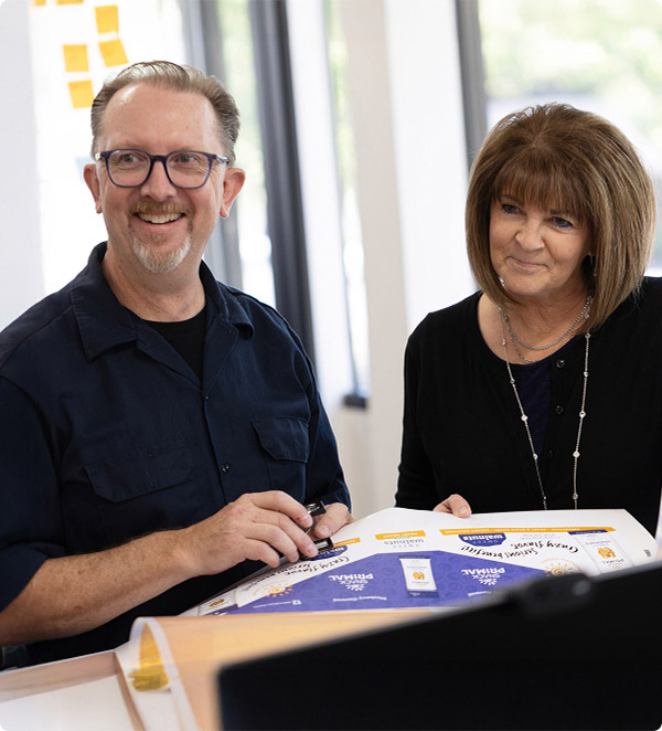 Eric and Sherril proofing a packaging design