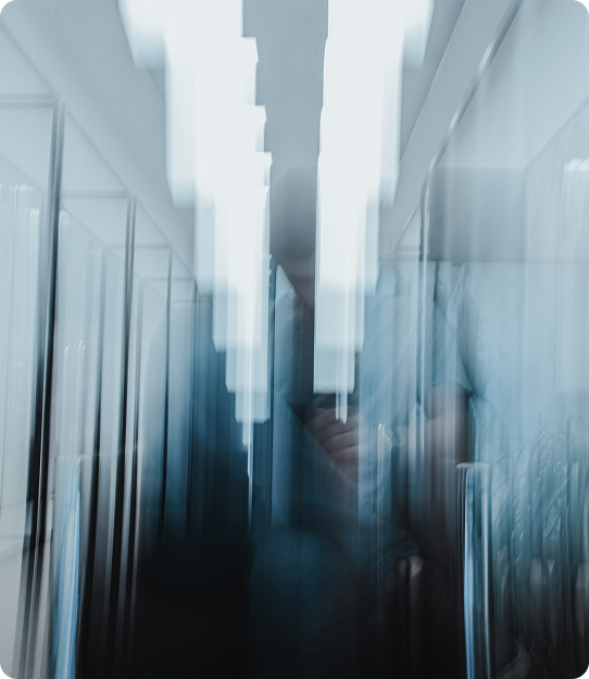 Blurry image of people walking through an airport.