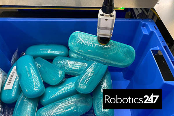 robotic arm picking Zenni glasses cases