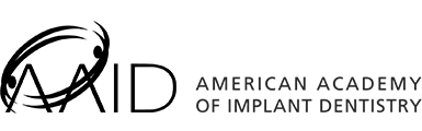 Logo of the American Academy of Implant Dentistry with a tooth symbol.