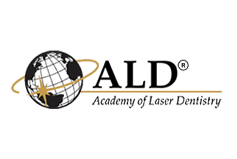 Logo of the Academy of Laser Dentistry featuring a globe with a gold star.