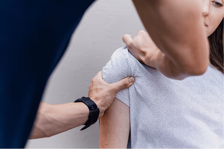An image of a physiotherapist treating shoulder pain