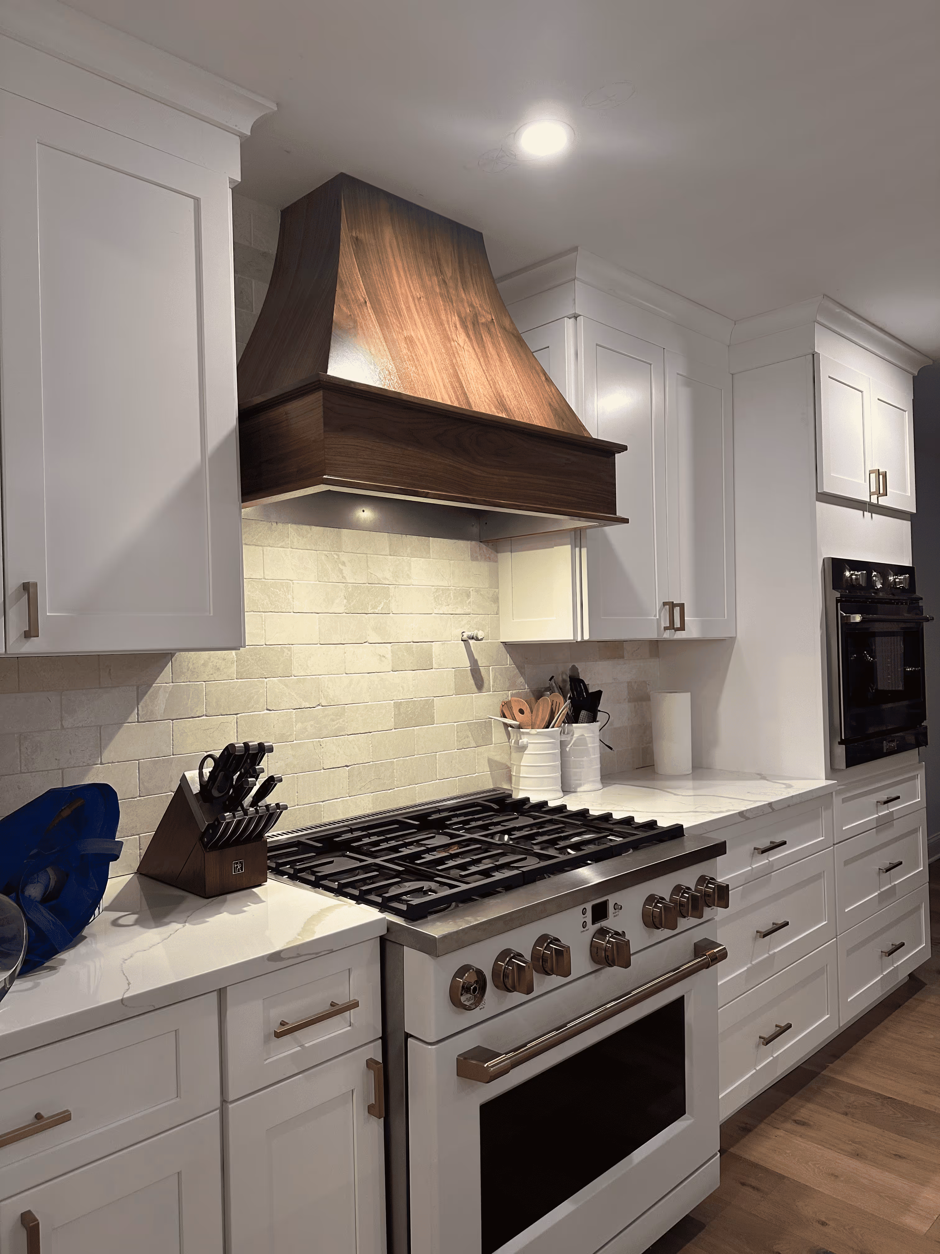 Spacious New Jersey kitchen remodel featuring quartz countertops, shaker cabinets, and pendant lighting.