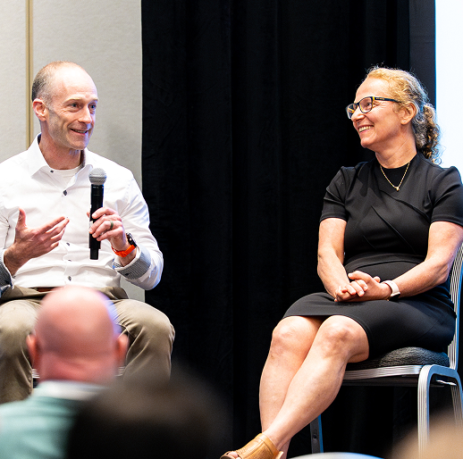 Panel sitting at a speaking event