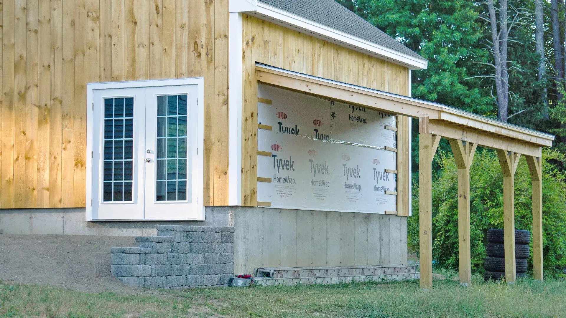 Residential construction project with wood siding installation showcasing professional home-building services.