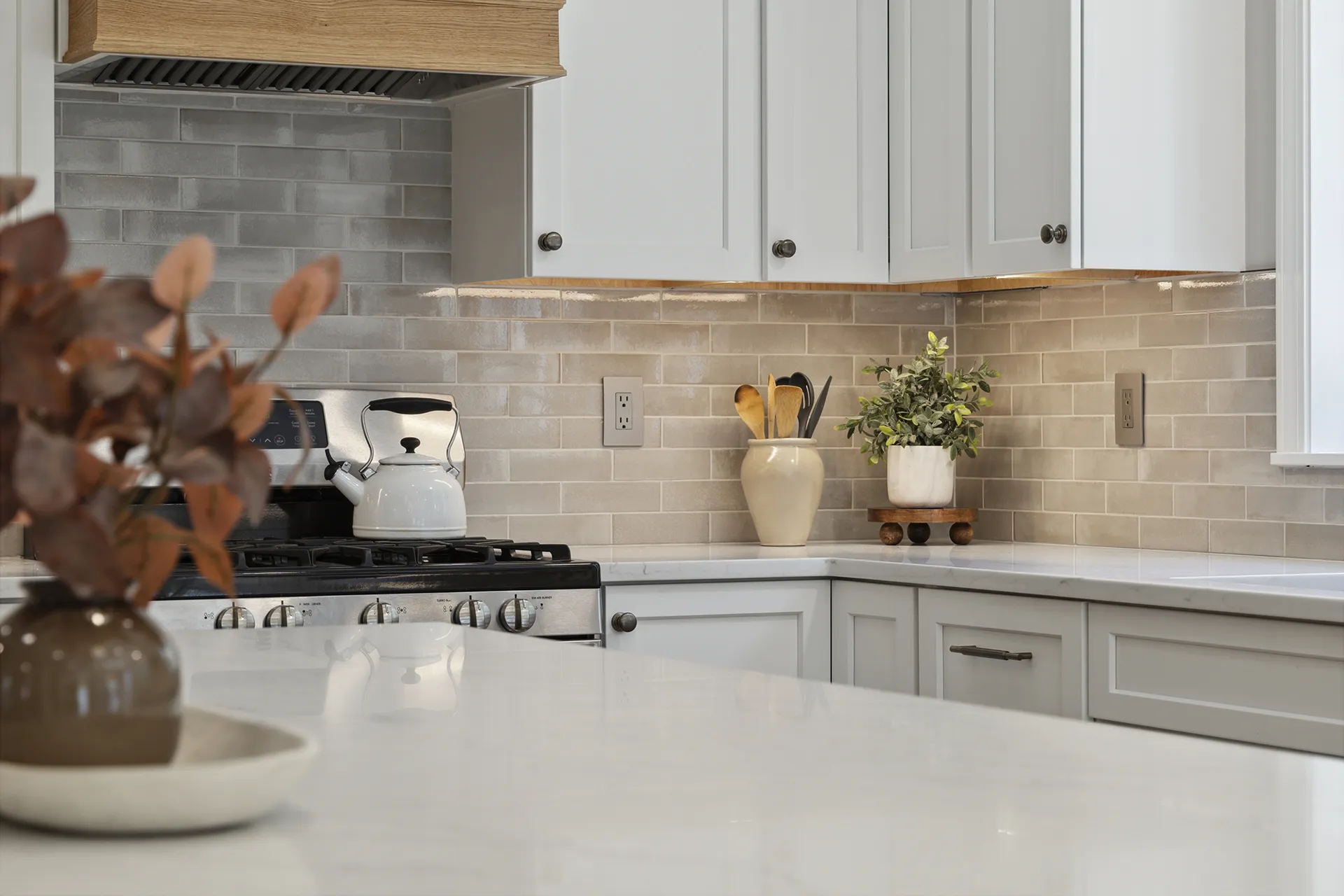 Kitchen remodel in Nashua, NH — white oak flooring and warm white paint palette