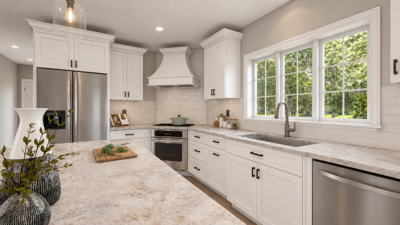 Londonderry, NH kitchen remodel — range and custom white hood centered on the corner wall with subway tile and stone counters