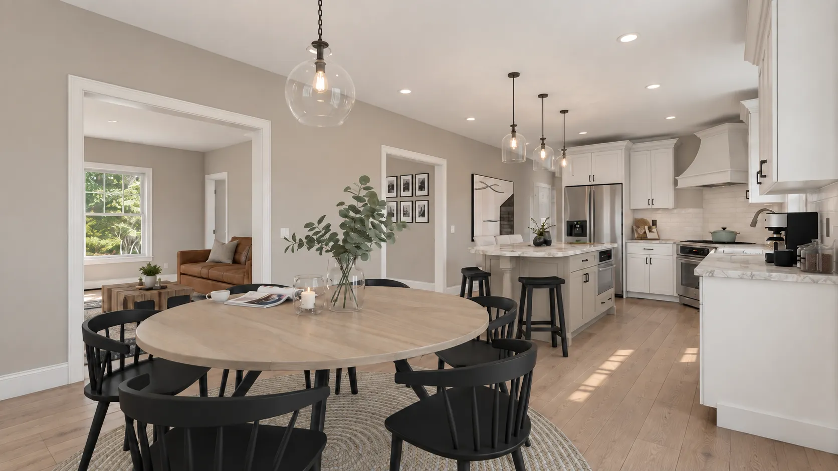 Dining room opening to the remodeled kitchen in Londonderry, NH — white oak floors carried through both rooms