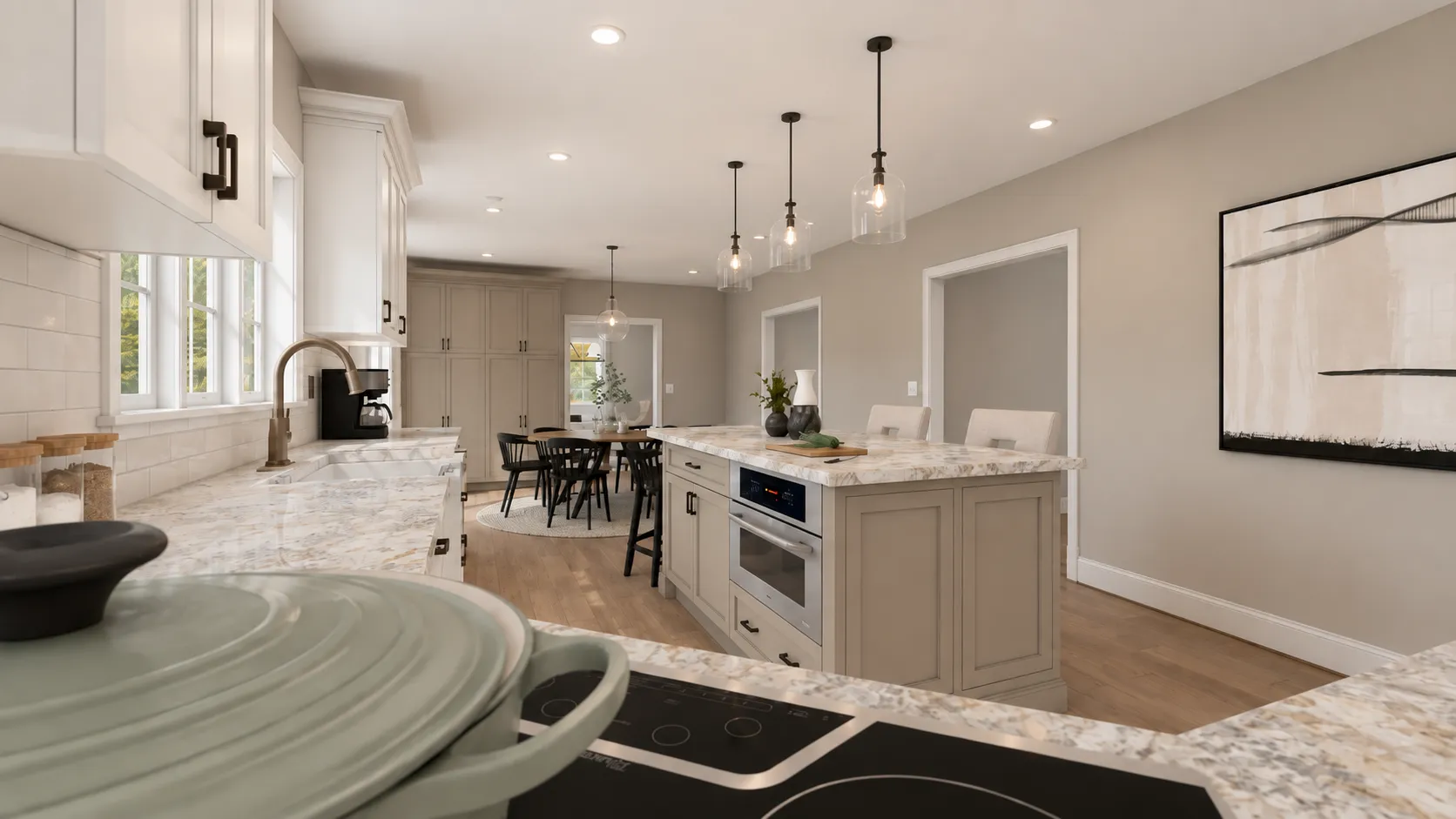 Londonderry, NH kitchen remodel — cooktop, stone counters and the pantry wall beyond the island