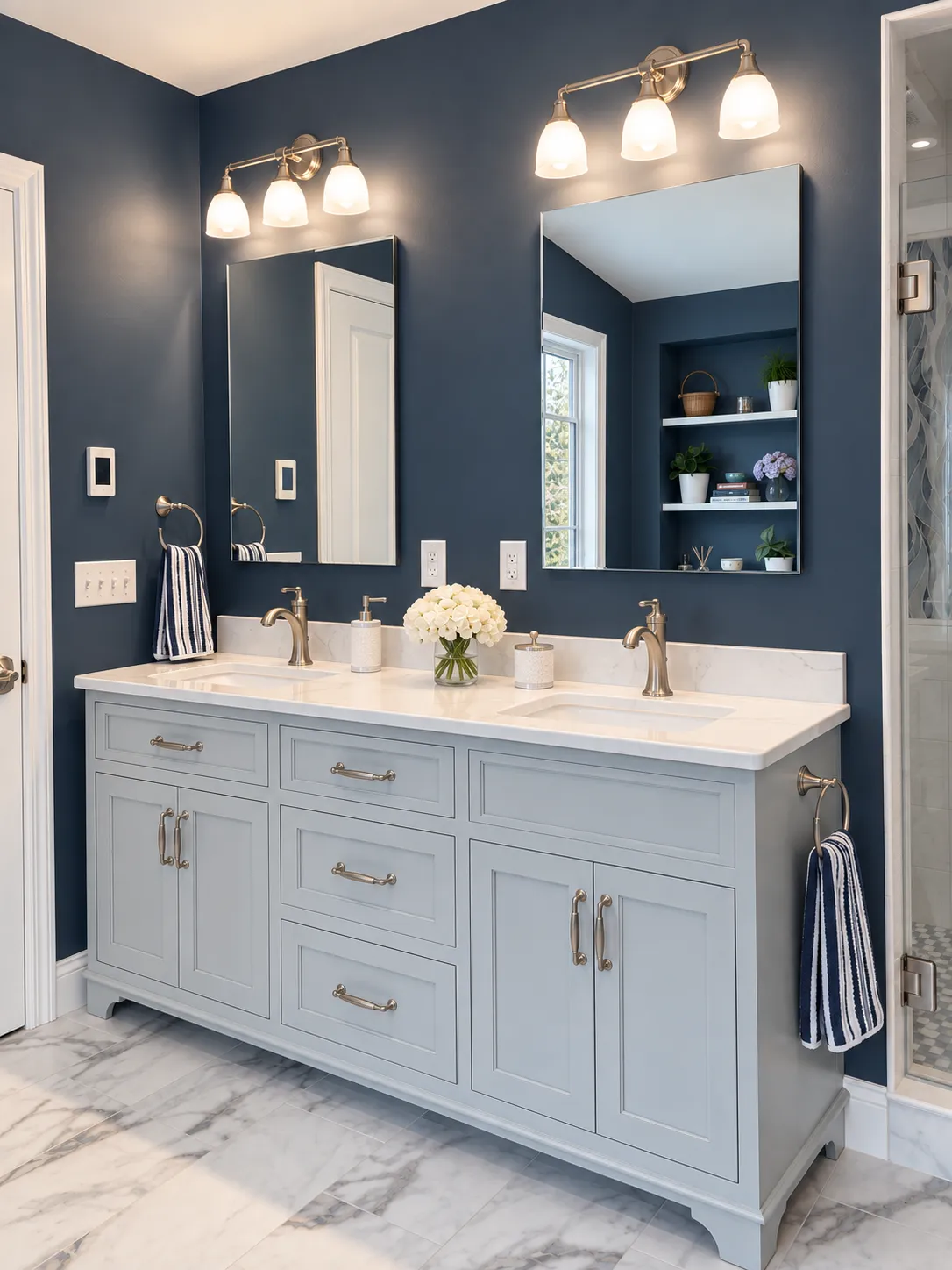 Double vanity in soft gray with a marble-look top, brushed nickel fixtures and sconces in a Bedford, NH bathroom remodel