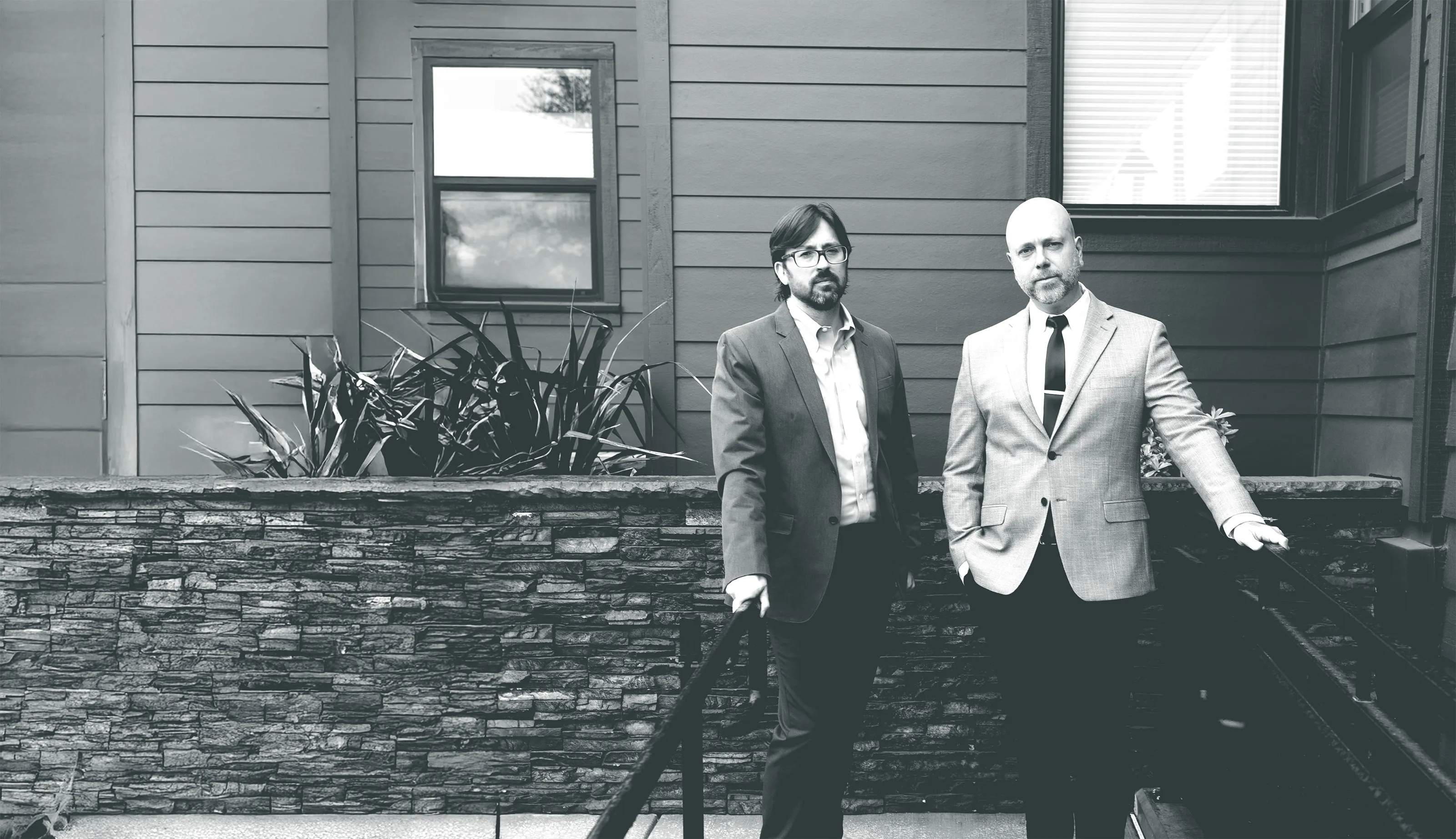 Derek Larwick and Keith Reed outside of the Larwick Law Firm office