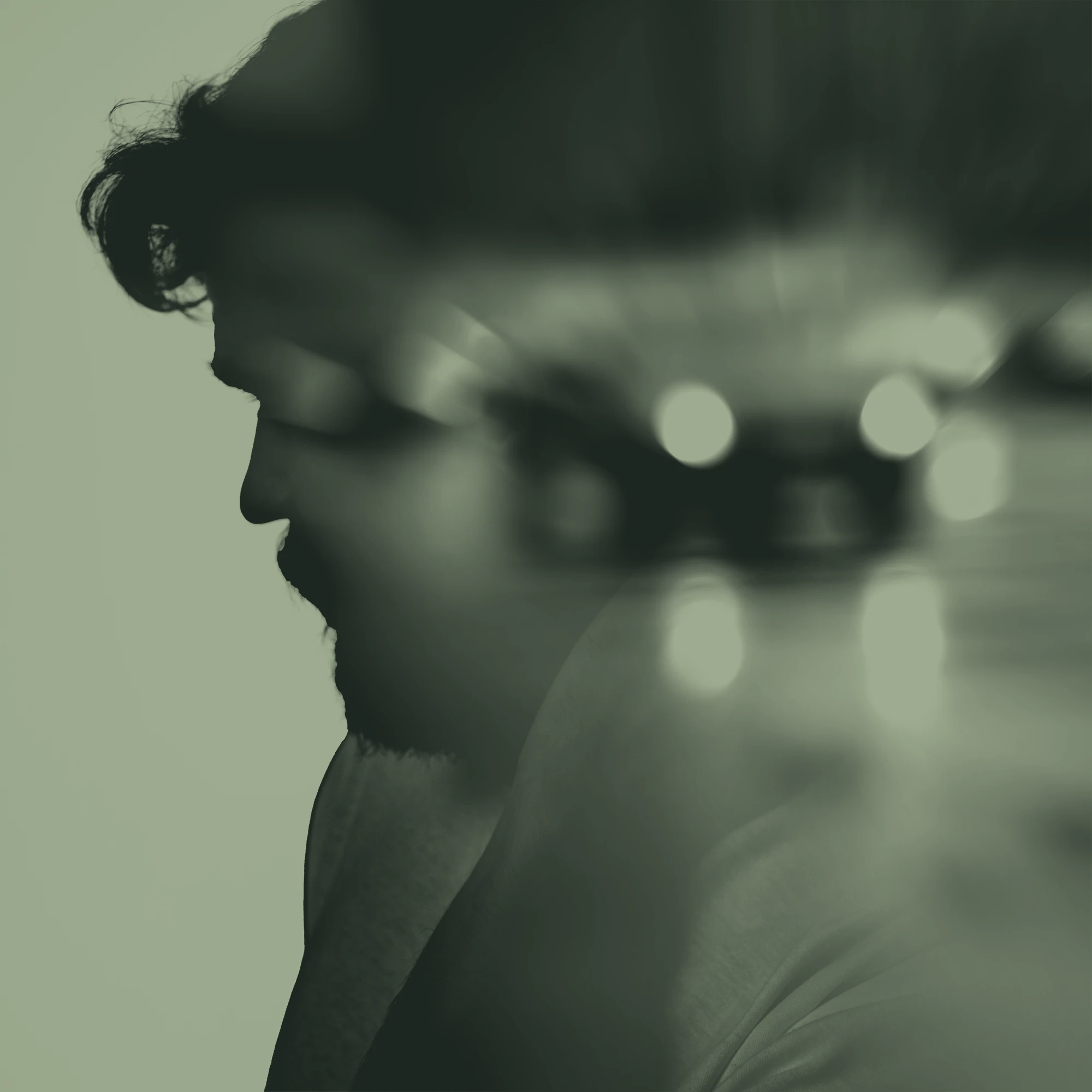 Male silhouette blended with blurred car lights