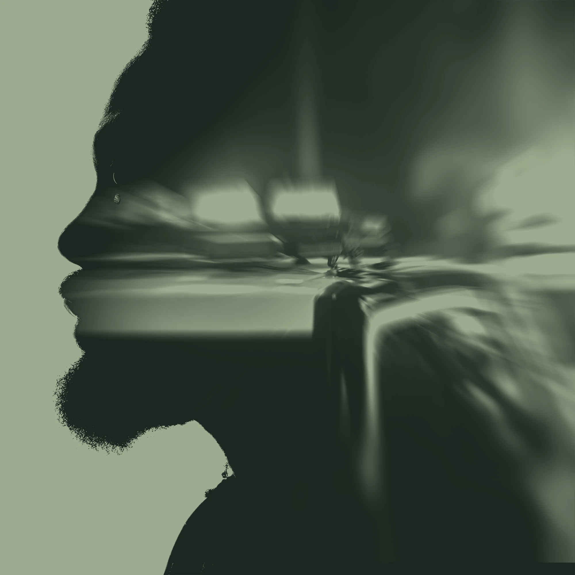 Silhouette of man with blurred police lights in background