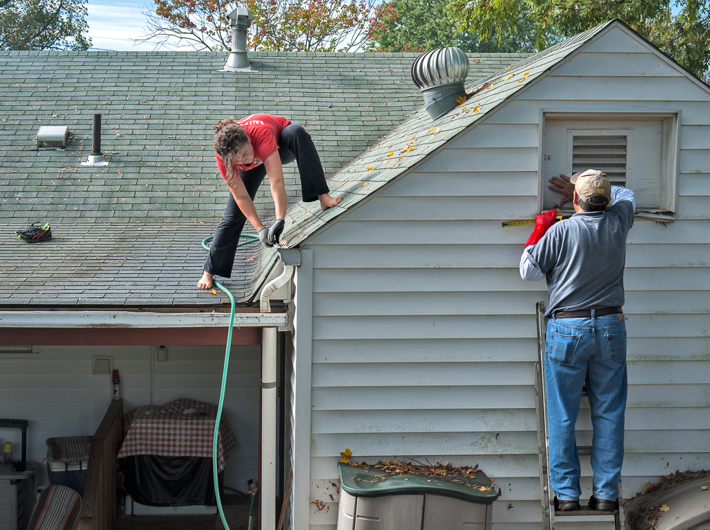 Volunteers repairing a roof