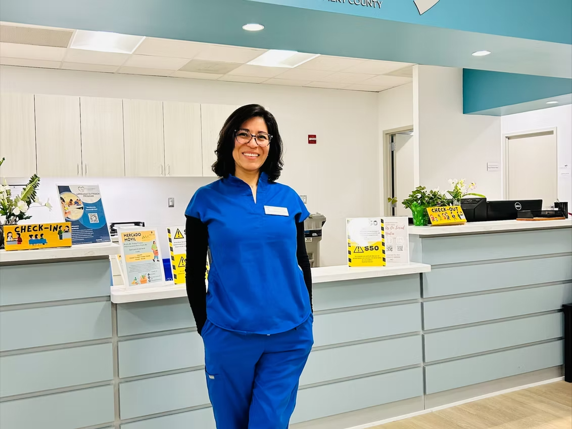 A nurse at the front desk