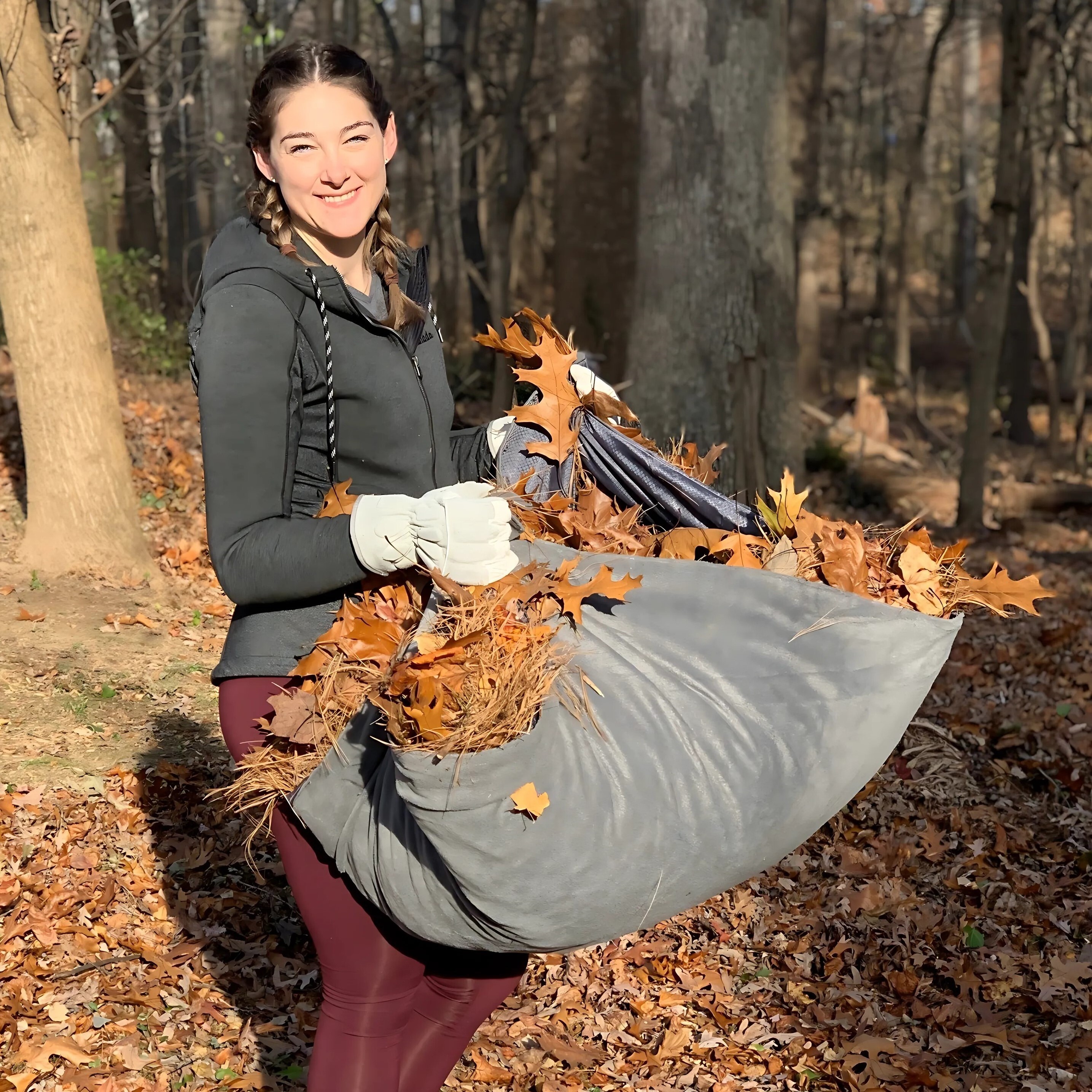 Volunteer girl clearing the yard.