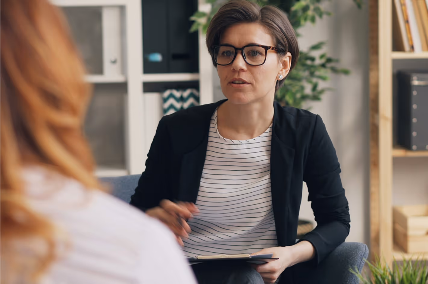 Photo of a therapist working with a young person