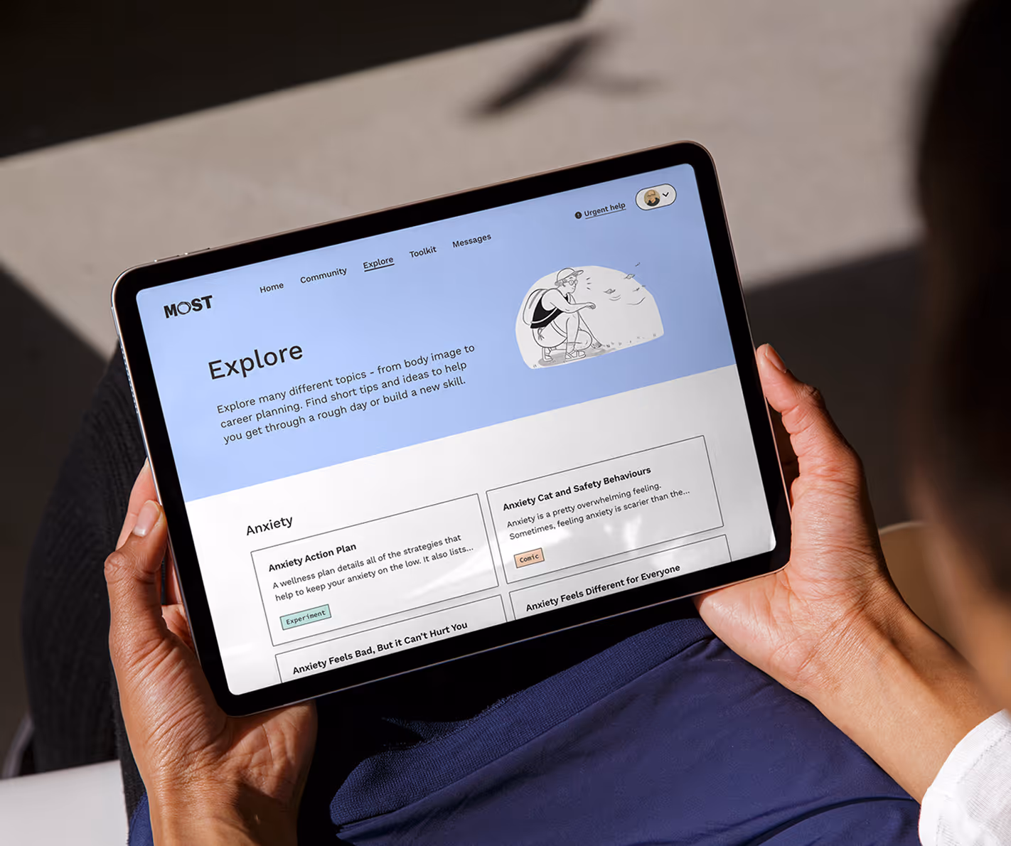 Photo of a young person holding a tablet using MOST