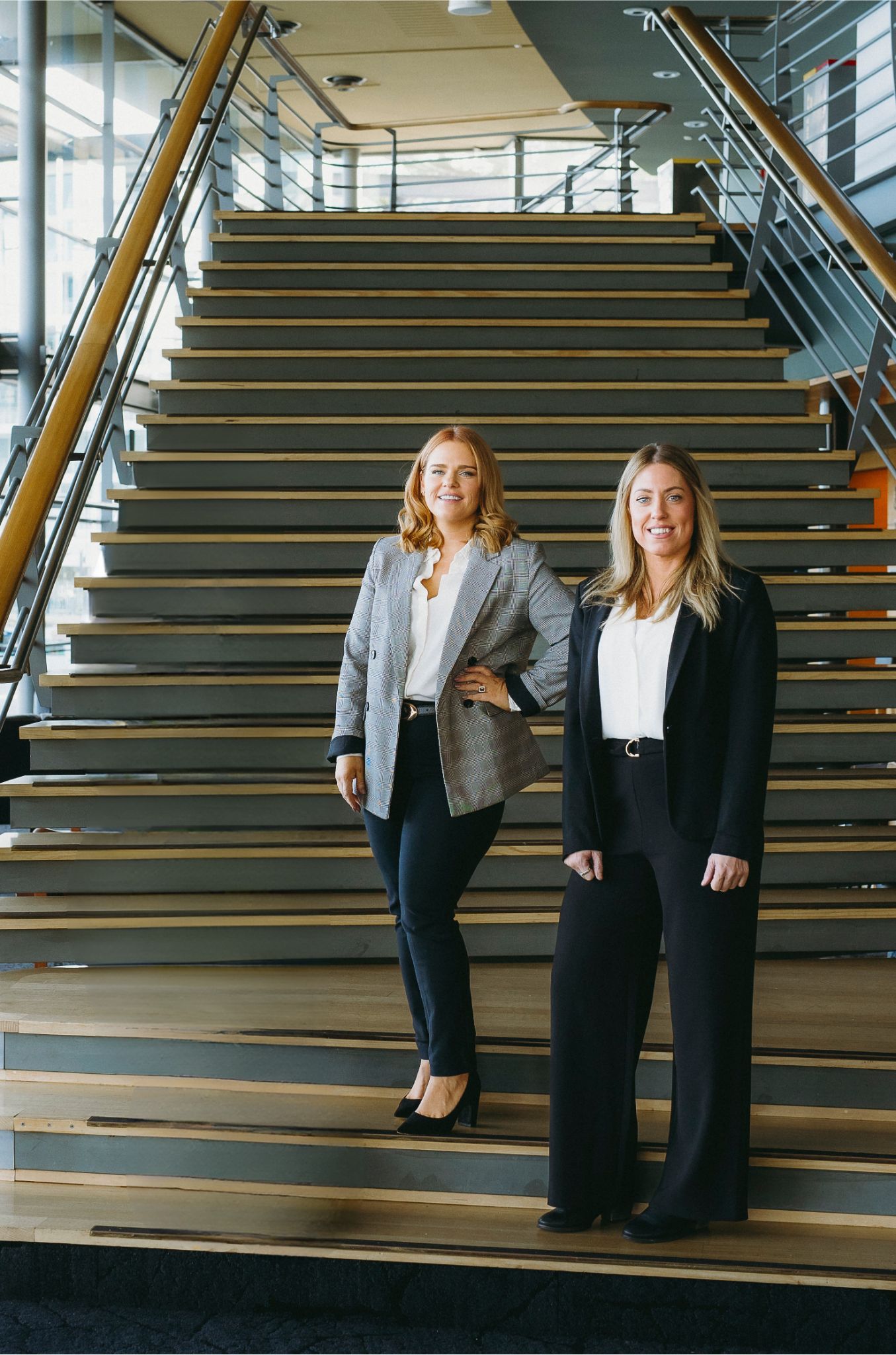 Naomi & Hollie stood on the stairs