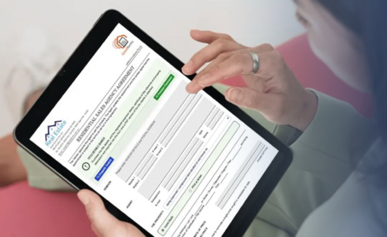 Person using a tablet displaying a GreatForms digital form integrated with the RealtyAssist platform.
