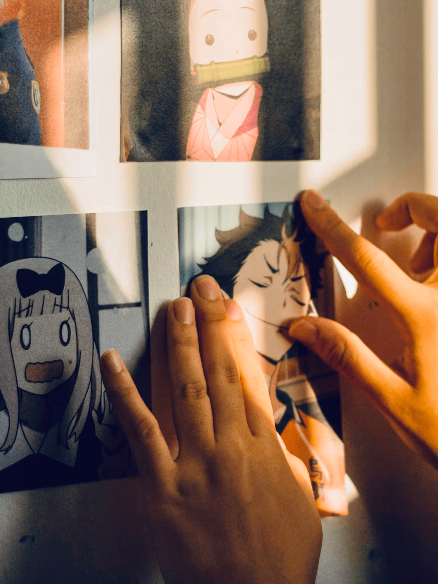 Someone hanging up anime pictures because we also love anime.