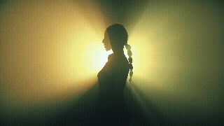 Silhouetted dancer with light effects from a creative video production project in Melbourne