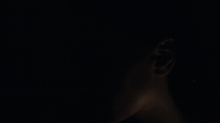 Dramatic lighting and shadow in a stylised beauty shot for video production in Melbourne