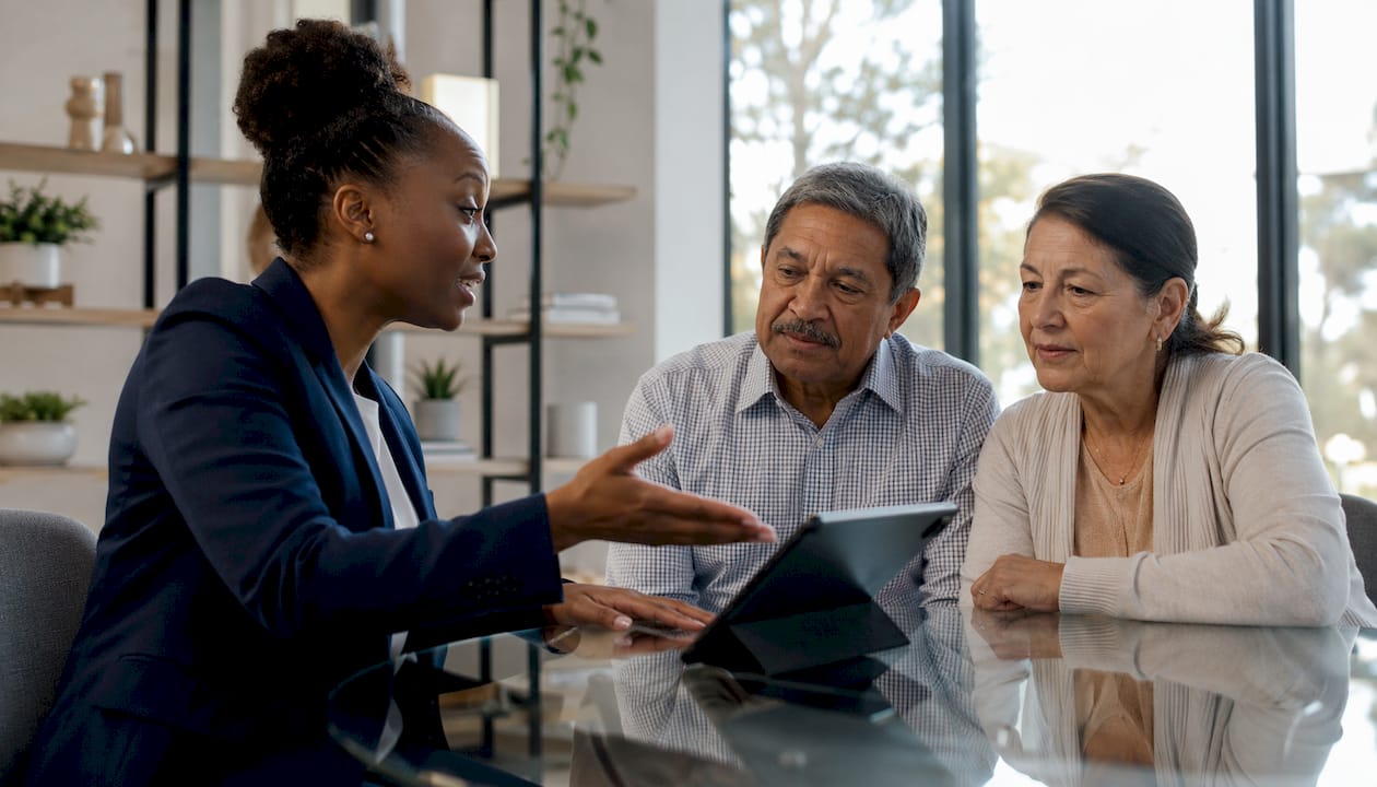 Loan officer advising borrowers in meeting